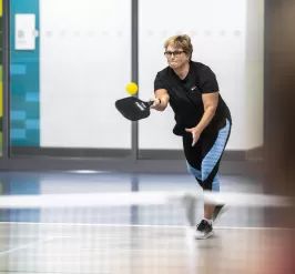 Women playing pickleball 