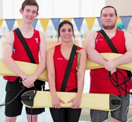 Three Lifeguards standing by pool