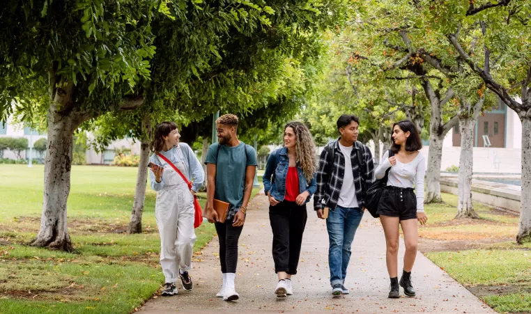 five young people walking together