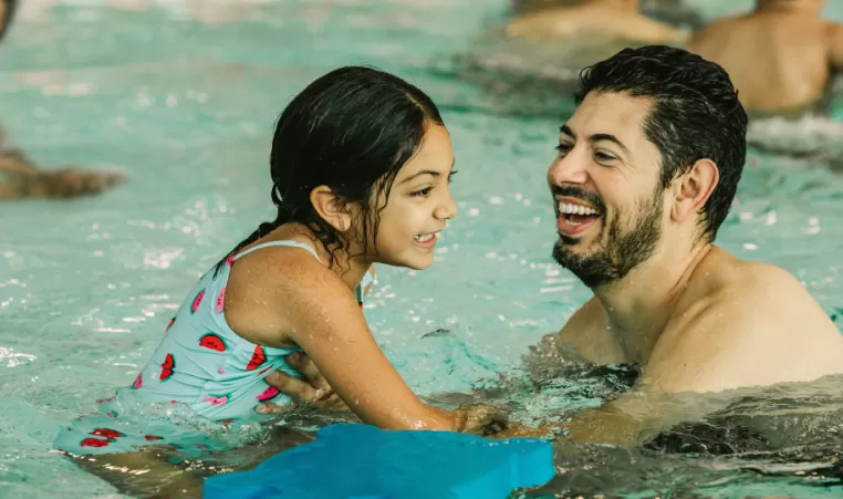 Daughter and Father in Pool