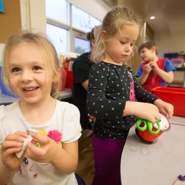 School age girls making crafts